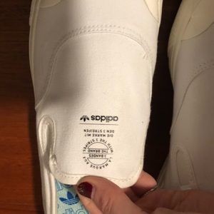 White Adidas slip on sneakers- new with tags.